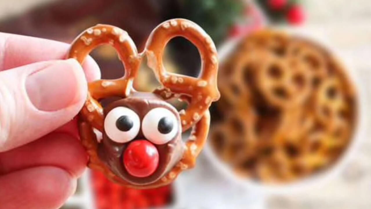 person holding up an individual rolo pretzel reindeer
